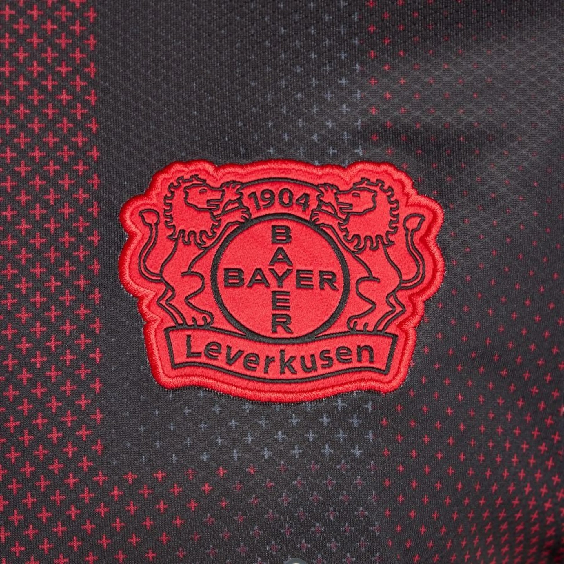 team logo view on the New Balance Bayer Leverkusen 2025/26 Home Black Shirt
