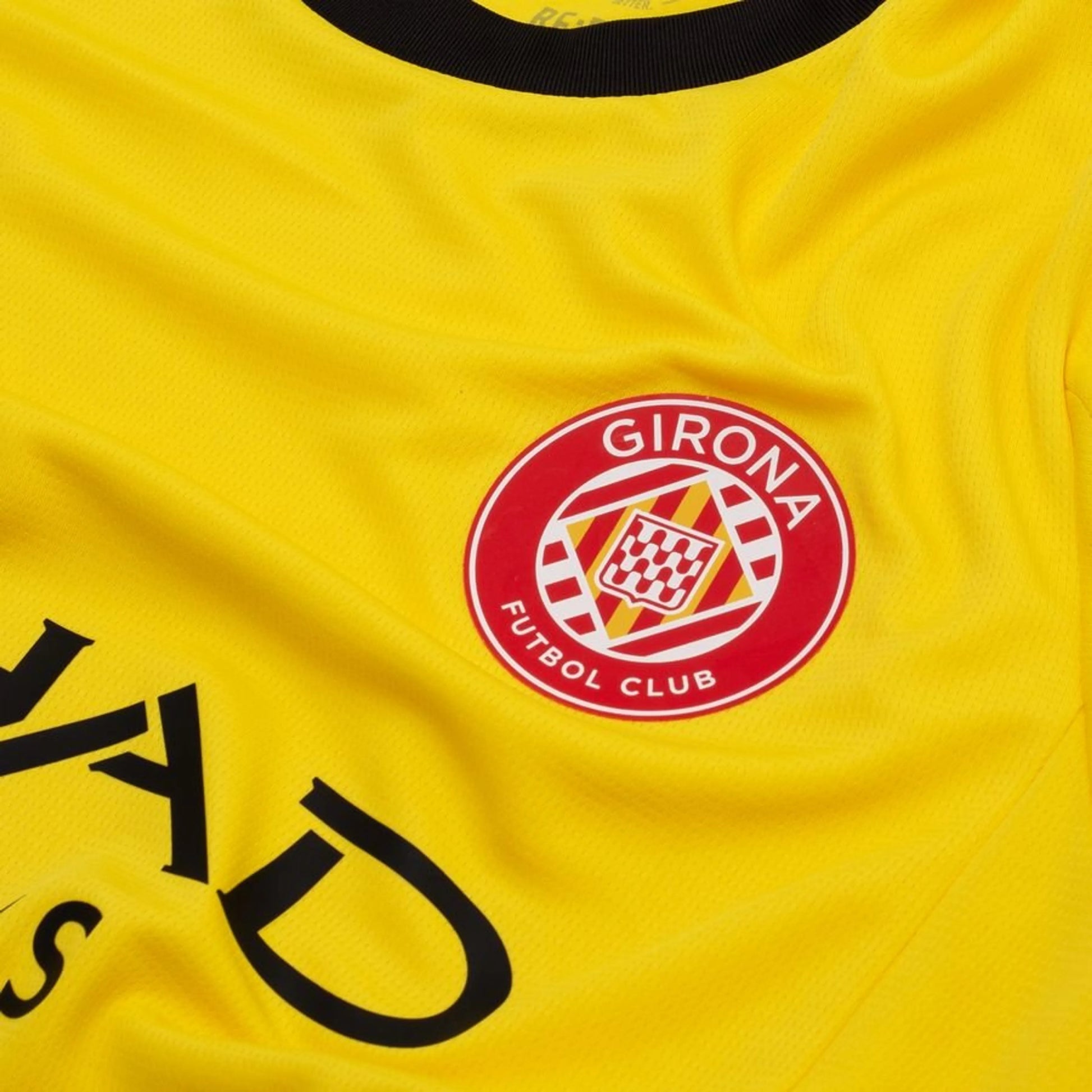 team logo view on the PUMA Girona FC 2025/26 Away Yellow Shirt