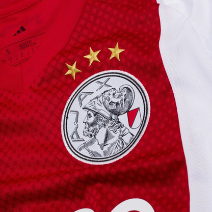 team logo view on the adidas Ajax 2025/26 Home Red and White Shirt