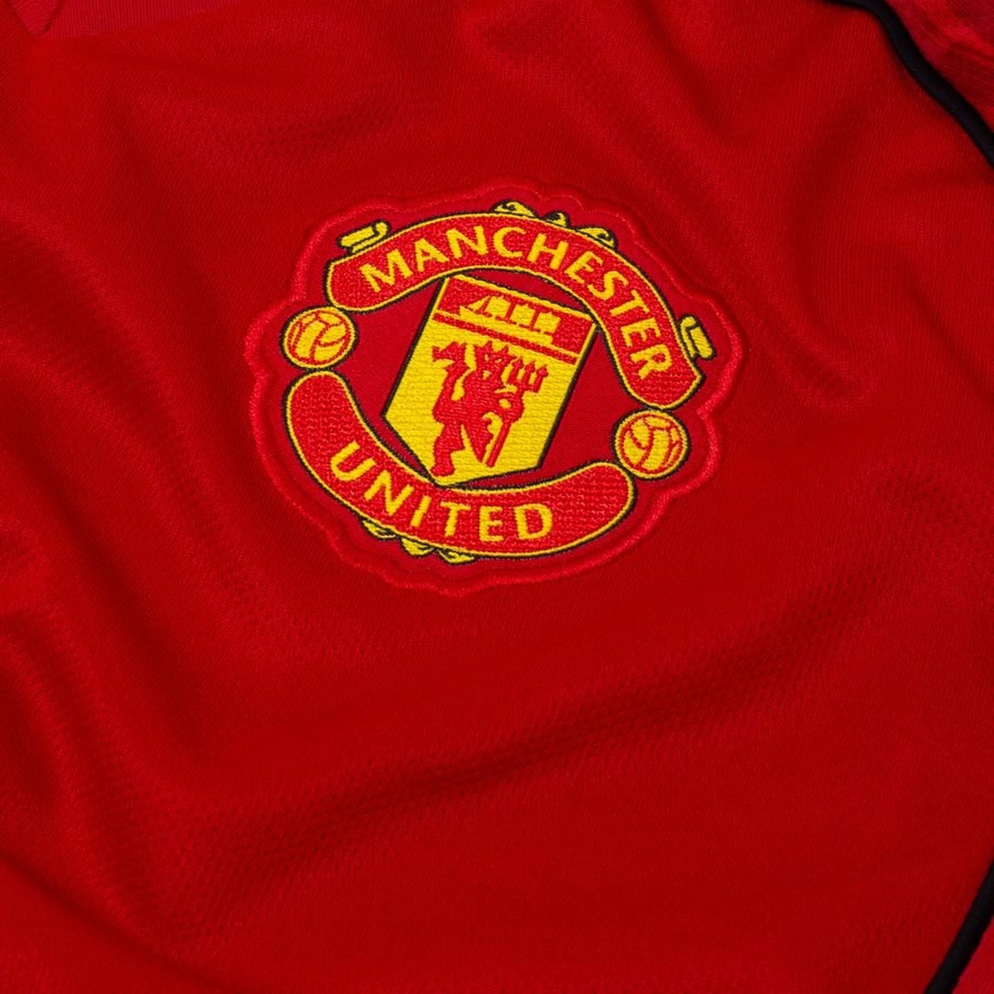 team logo view of the adidas Manchester United Home Shirt 2025/26 Women - Red/White/Black